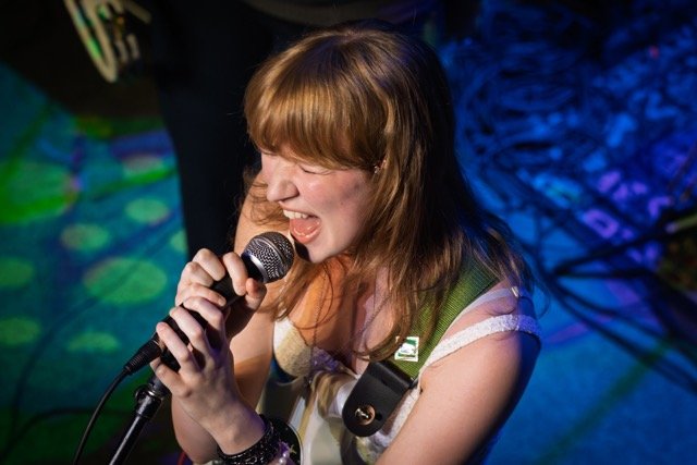 Quarter Bend student Jocelyn performing on stage