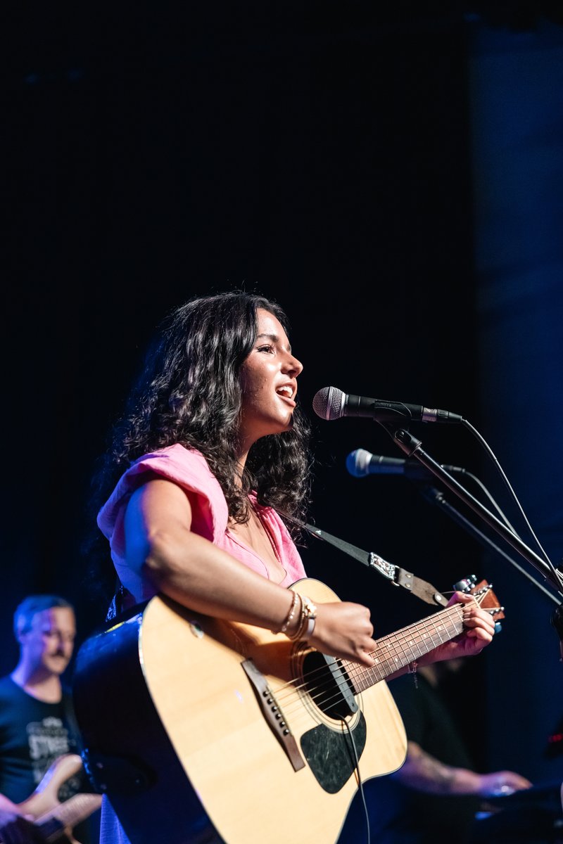 Quarter Bend student Juliet performing on stage